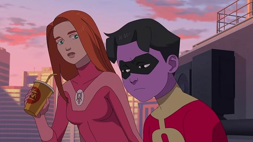 Animated rendering shows Atom Eve and Rex Splode standing against a city skyline backdrop. Atom Eve, with long red hair, green eyes, and a pink superhero suit, holds a drink and displays a slightly concerned expression. Rex Splode, depicted with purple skin and a black eye mask, appears somber and downcast in a red and black suit.
