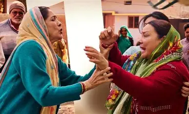 "Panchayat" Season 4 review still; two women in traditional Indian clothing emotionally confront each other, one appearing distraught and crying, with onlookers in the background.