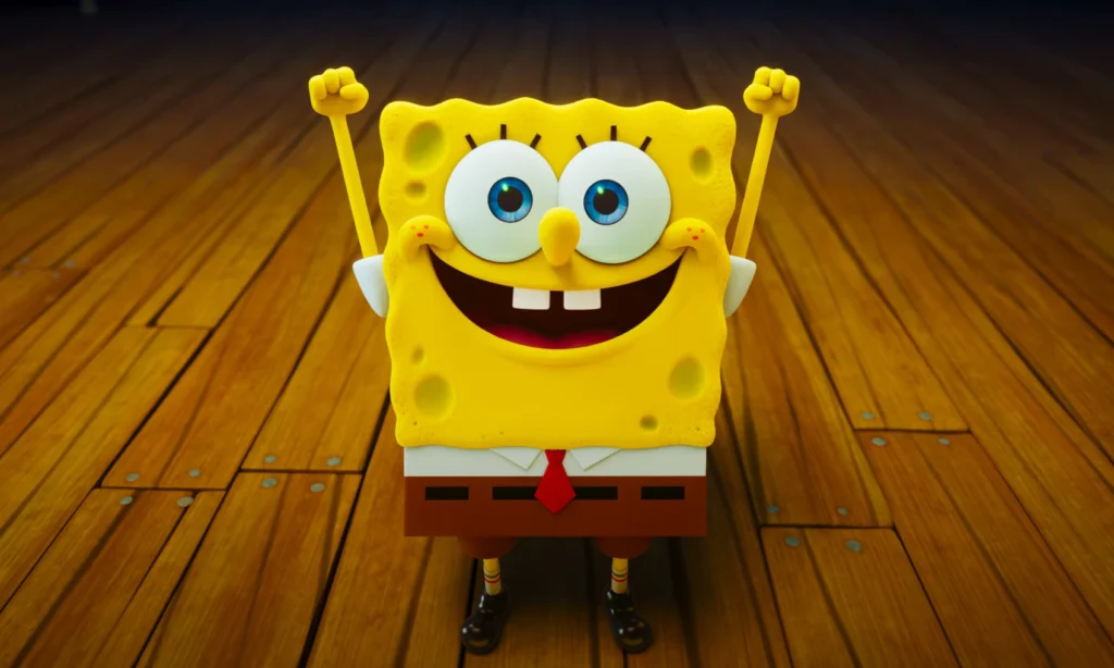 Rendering of SpongeBob SquarePants with arms raised on a wooden floor, as seen in the SpongeBob movie 2025 trailer.